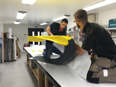 Wrapping the Windmill blades for Banksy, in our Bristol workshop