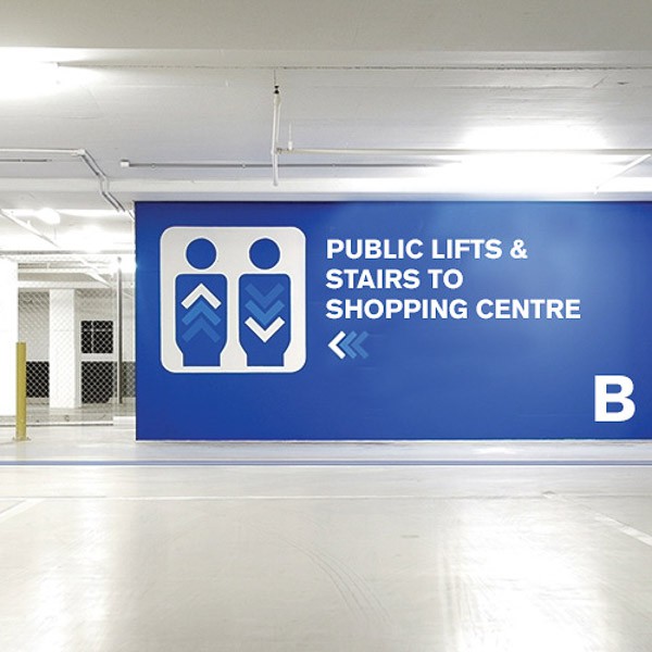 Digitally printed, way finding wall graphics informing direction in a car park
