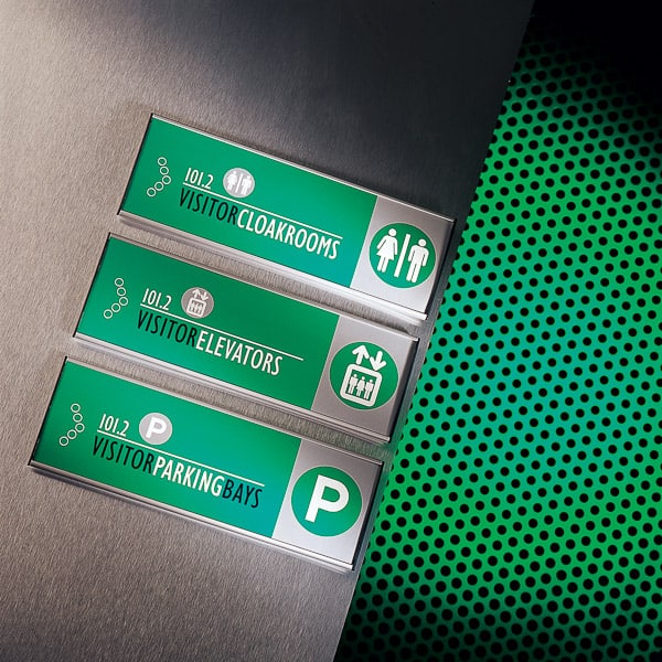 Wall mounted directional signs with green colour coding