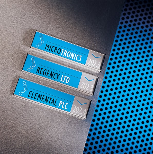Wall mounted directional signs with blue colour coding