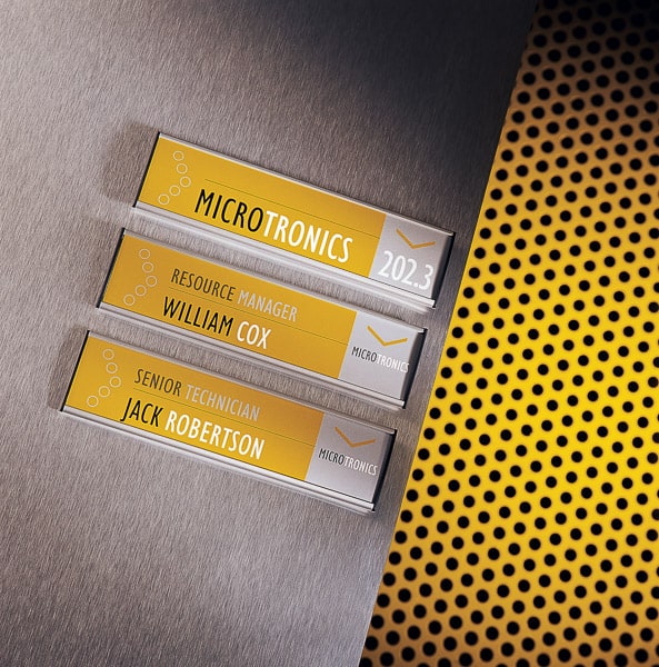 Wall mounted directional signs with yellow colour coding