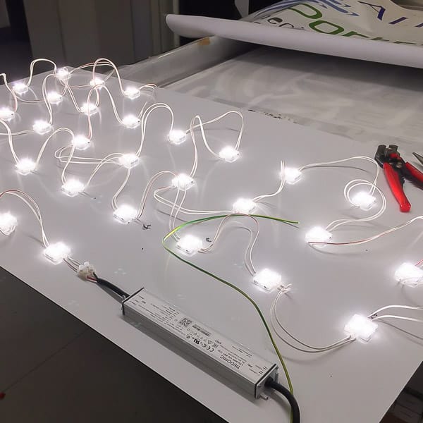 LED's being installed to a carrier panel for an illuminated fascia sign