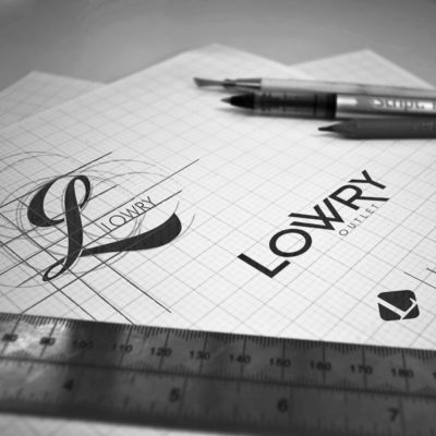 Pencil sketches of a custom logo design in production for a Shopping Centre