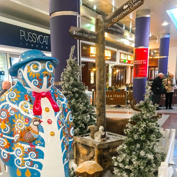 Natural Wooden Signage at Shopping Centre - Wide Shot