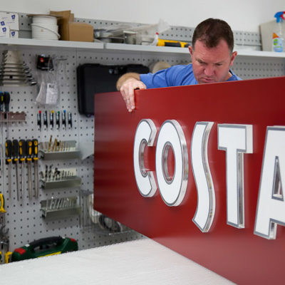 Shopping centre sign for a coffee shop being assembled in the workshop