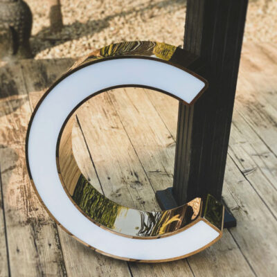 Rim and return metal letter with an illuminated acrylic face