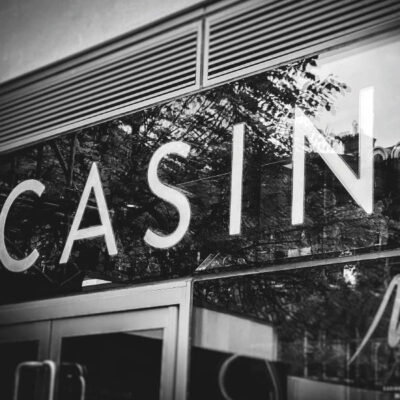 Rim and return metal letters behind glass in a casino Rim and return metal letters behind glass in a casino