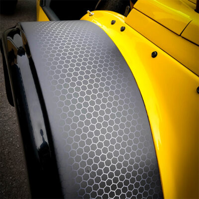 Surface transformation of a vehicle with carbon fibre effect